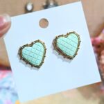 Enchanting Green Heart Studs with Gold Trim